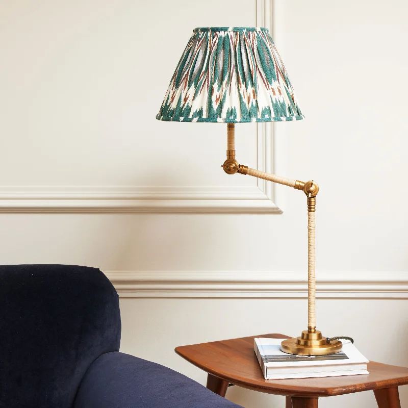 glass table lamps with a frosted surface for soft light diffusionAbel table lamp in brass and natural rattan